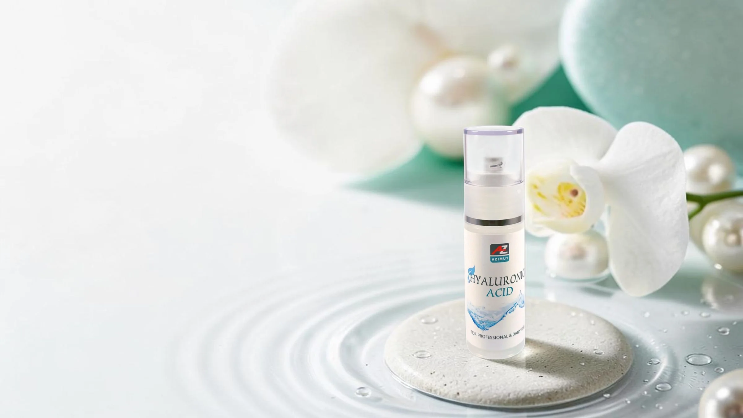 Le’Spa hyaluronic acid on a stone in water with a white orchid